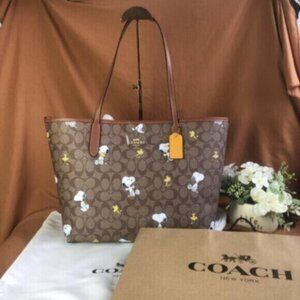 Coach X Peanuts City Tote In Signature Canvas With Snoopy Woodstock Print